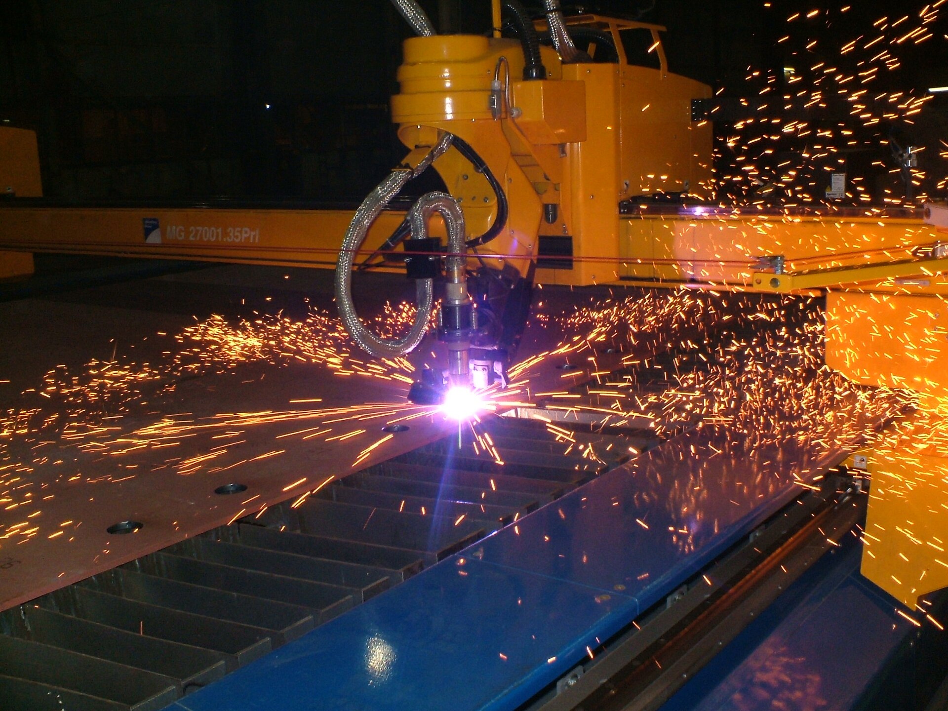 Computer-controlled plasma cutting with a shower of sparks